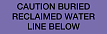 Purple with Black 'CAUTION BURIED RECLAIMED WATER LINE BELOW' printing